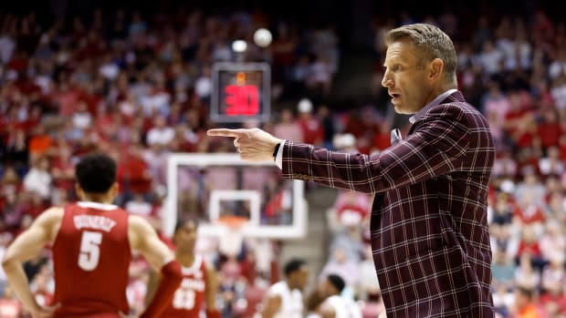 Alabama Crimson Tide head coach Nate Oats reacts to a call against the Auburn Tigers during the first half of an NCAA basketball game at Coleman Coliseum.